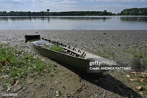 Photo taken on July 5 show a disused boat sitting on the dry banks of the Po River in the area of the municipality of Polesella, in the region of...