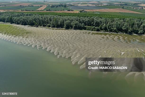 An aerial view taken on July 5 show the banks and river bed with low levels of the Po River in the area of the municipality of Canaro, in the region...