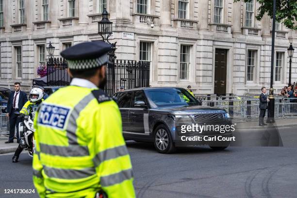 Car forming part of the cavalcade carrying Britain's Prime Minister, Boris Johnson, to Parliament for weekly Prime Minister's Questions, leaves...