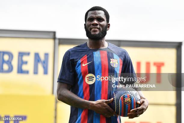 Barcelona's new Ivorian midfielder Franck Kessie poses for pictures during his presentation ceremony at the Joan Gamper training ground in Sant Joan...