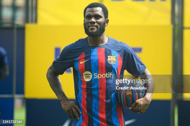 Barcelona's new Ivorian midfielder Franck Kessie poses with a ball during his presentation ceremony at the Joan Gamper training ground in Sant Joan...