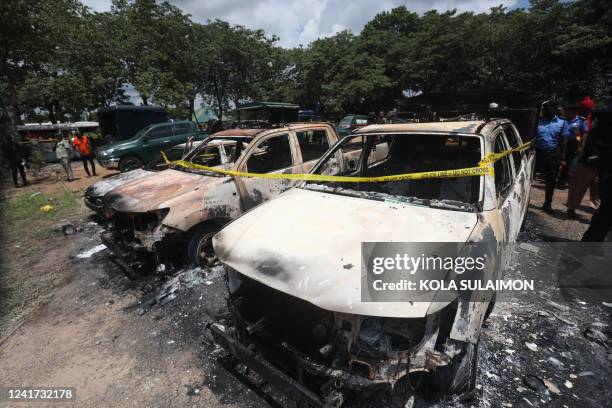 Burnt prison vehicles are seen in Abuja, Nigeria on July 6 after suspected Boko Haram gunmen attacked the Kuje Medium Prison. Suspected Boko Haram...