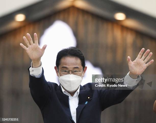 Japanese Prime Minister Fumio Kishida waves to a crowd as he visits Akita, northeastern Japan, on July 6 for a speech ahead of the House of...