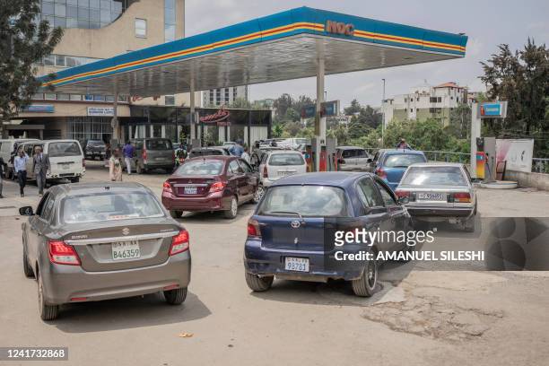 Cars wait in queue at a fuel station in Addis Ababa, Ethiopia, on July 6, 2022. Fuel prices soared in Ethiopia on July 6, 2022 after the government...