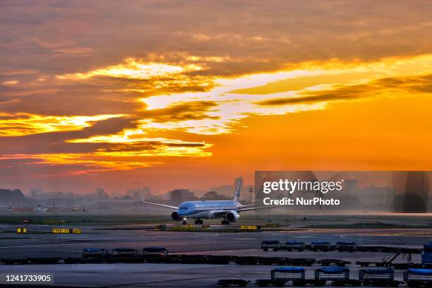 Royal Dutch Airlines airplane seen during sunrise at Amsterdam Airport Schiphol in Amsterdam, Netherlands, Europe, on May 03, 2022.