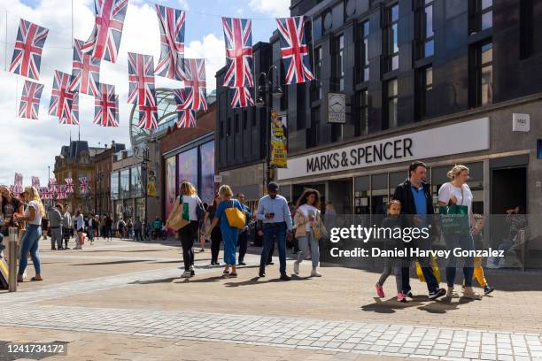 Members of the public, some with carrier bags of shopping, out and about in the city centre's high street as consumer confidence in the UK economy...