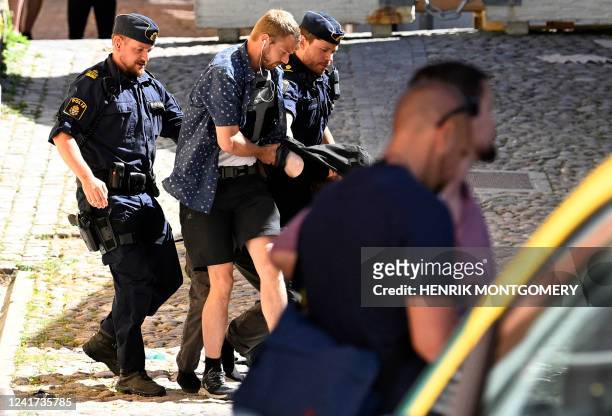 Police arrest a man suspected of seriously injuring by stabbing a woman at the Almedalen political festival in Visby on the Swedish island of Gotland...