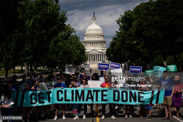 Environmental activists rally near the U.S. Capitol on July 6, 2022 in Washington, DC. The group Climate Action Campaign organized the rally to...