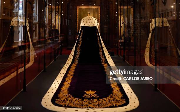 The Coronation Dress and Robe of Estate, worn by Britain's Queen Elizabeth II on her 1953 coronation, and designed by Norman Hartnell and Ede &...