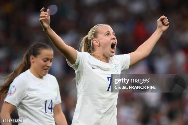 England's striker Beth Mead celebrates after scoring the opening goal of the UEFA Women's Euro 2022 Group A football match between England and...