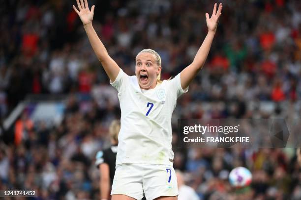 England's striker Beth Mead reacts to her shot crossing the line as she scores the opening goal of the UEFA Women's Euro 2022 Group A football match...
