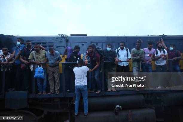 Passengers board the engine compartment of an overcrowded train in Colombo, Sri Lanka. On July 6, 2022. Other public transport in Sri Lanka has been...