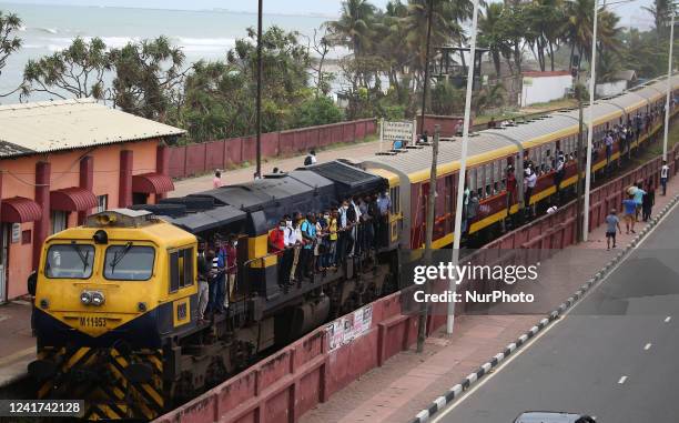 Passengers hang on the overcrowded train at Colombo, Sri Lanka. On 6 July 2022. Other public transport in Sri Lanka has been disrupted due to a huge...