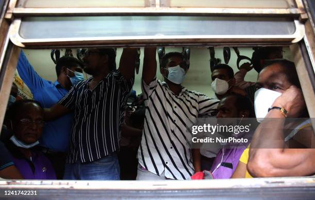Passengers travel on an overcrowded train in Colombo, Sri Lanka. On July 6, 2022. Other public transport in Sri Lanka has been disrupted due to a...