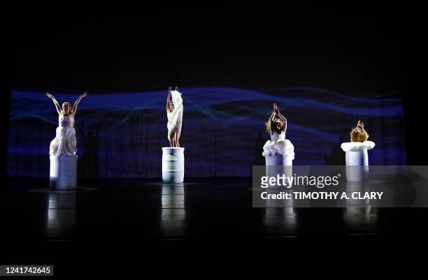 Dancers perform "Pool of Tears" during dress rehearsal before opening night of MOMIX and artistic director Moses Pendelton's latest creation, "ALICE"...