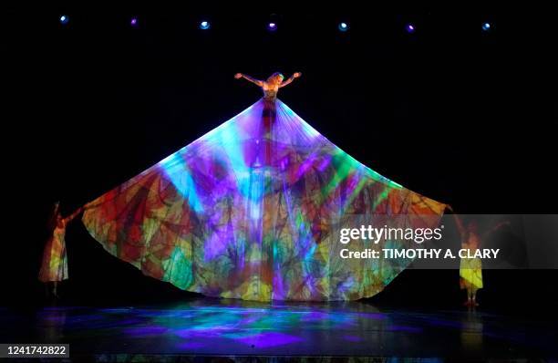 Dancers perform "Go Ask Alice" during dress rehearsal before opening night of MOMIX and artistic director Moses Pendelton's latest creation, "ALICE"...