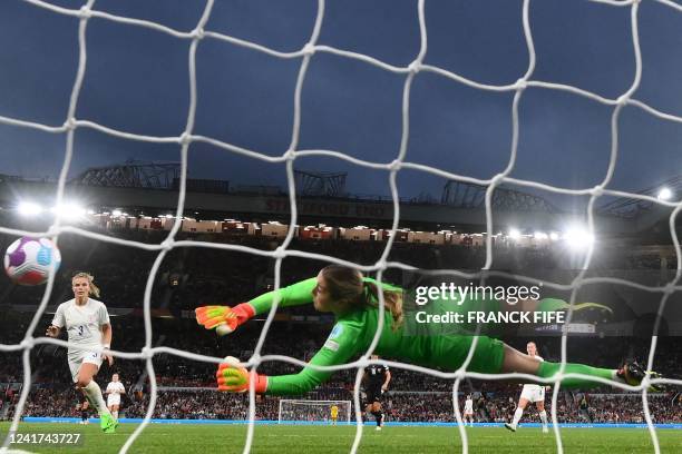 England's goalkeeper Mary Earps makes a save during the UEFA Women's Euro 2022 Group A football match between England and Austria at Old Trafford in...