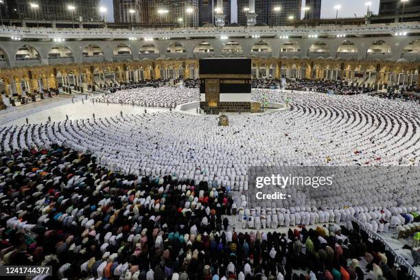 Muslim worshippers and pilgrims pray around the Kaaba, Islam's holiest shrine, at the Grand Mosque in Saudi Arabia's holy city of Mecca on July 6,...