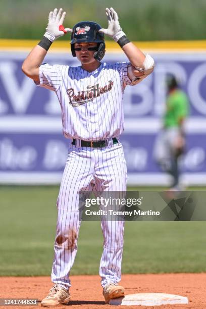 Nick Cicci of the Missoula Paddleheads gestures to the crowd at second base during a Pioneer League baseball game against the Great Falls Voyagers on...