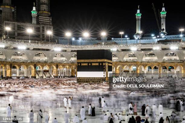 Muslim pilgrims circumambulate around the Kaaba, Islam's holiest shrine, during the annual Hajj pilgrimage at the Grand Mosque in Saudi Arabia's holy...