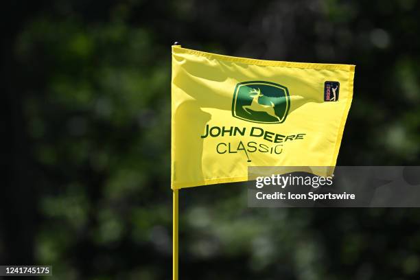 John Deere Classic flag flies in a stiff breeze on the hole during the final round of the John Deere Classic Golf Tournament on July 03 at TPC Deere...