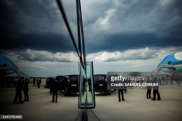Secret Service, White House staff, and members of the press wait for US President Joe Biden to disembark from Air Force One upon arrival at Joint...
