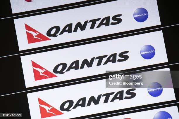 Qantas Airways Ltd. Branding on a screen at Sydney Airport in Sydney, Australia, on Wednesday, July 6, 2022. Qantas, which carries the slogan "Spirit...