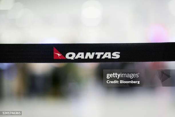 Qantas Airways Ltd. Branding on a barrier tape at their check-in counters at Sydney Airport in Sydney, Australia, on Wednesday, July 6, 2022. Qantas,...