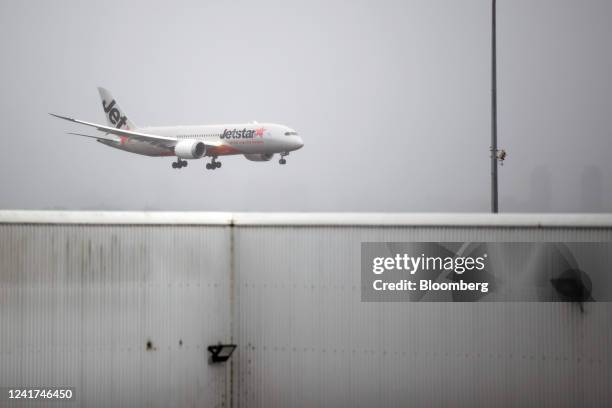 An aircraft operated by Qantas Airways Ltd.'s low-cost unit Jetstar Airways approaches Sydney Airport in Sydney, Australia, on Wednesday, July 6,...