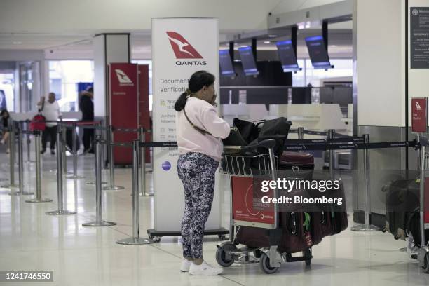 Passenger queues at a Qantas Airways Ltd. Check-in counter at Sydney Airport in Sydney, Australia, on Wednesday, July 6, 2022. Qantas, which carries...