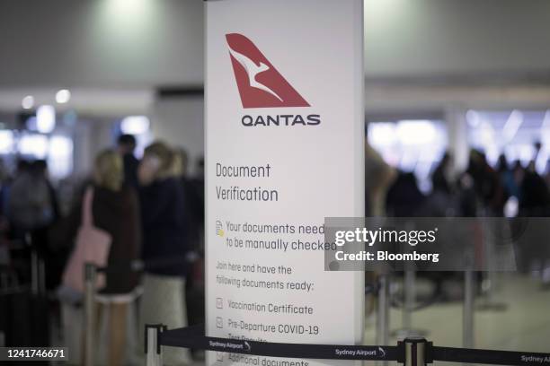 Signage at a Qantas Airways Ltd. Check-in counter at Sydney Airport in Sydney, Australia, on Wednesday, July 6, 2022. Qantas, which carries the...