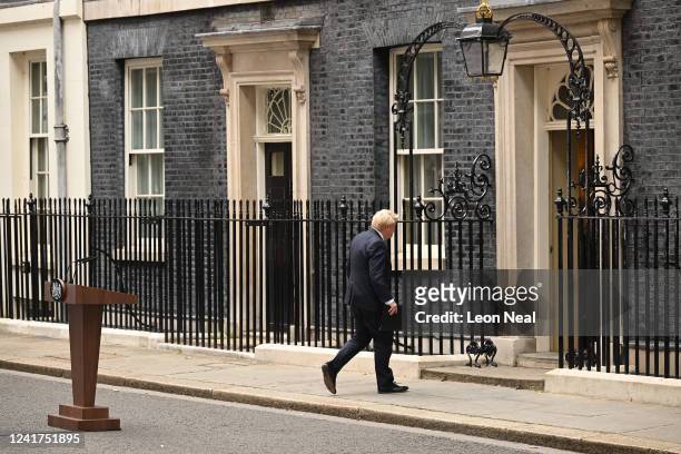 Prime Minister Boris Johnson returns to 10 Downing Street after he addressed the nation to announce his resignation on July 7, 2022 in London,...