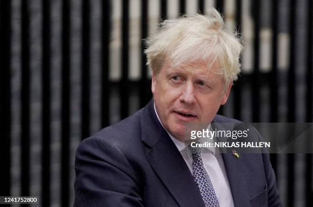 Britain's Prime Minister Boris Johnson makes a statement in front of 10 Downing Street in central London on July 7, 2022. - Johnson quit as...