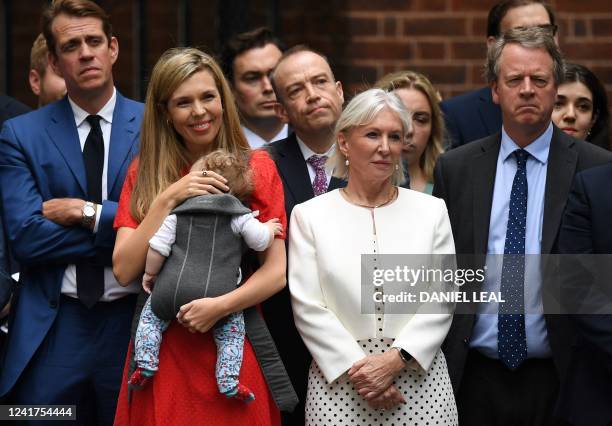 Britain's Conservative party chairman Ben Elliot , wife of Britain's Prime Minister Boris Johnson, Carrie Johnson and their daughter Romy, Britain's...