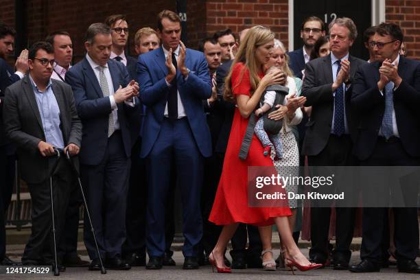 Carrie Johnson, and baby Romy walk past Culture Secretary Nadine Dorries and Scotland Secretary Alister Jack after Prime Minister Boris Johnson...