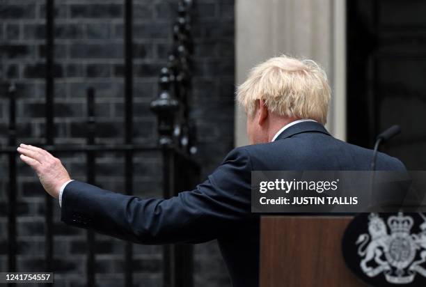 Britain's Prime Minister Boris Johnson leaves after making a statement in front of 10 Downing Street in central London on July 7, 2022. Johnson quit...
