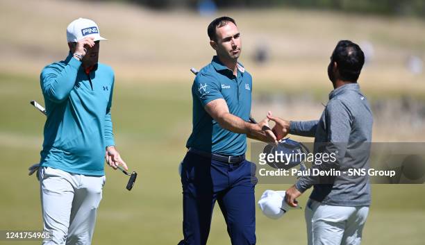 Cameron Tringale of the United States shake hands with Shubhankar Sharma during day one of the Genesis Scottish Open at the Renaissance Club, on July...