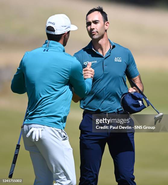 Cameron Tringale of the United States shake hands with Mito Peieira during day one of the Genesis Scottish Open at the Renaissance Club, on July 07...