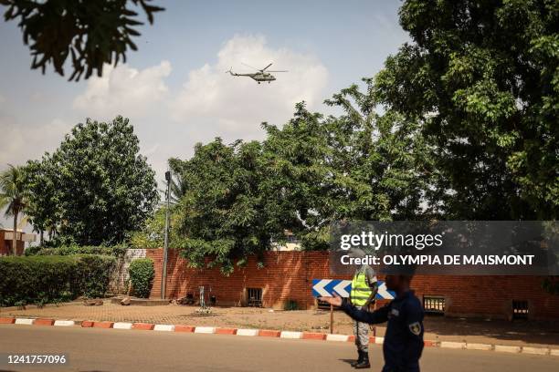 Helicopter transporting Blaise Compaore, former President of Burkina Faso, flies after he landed at the Ouagadougou airport on July 7, 2022 upon his...