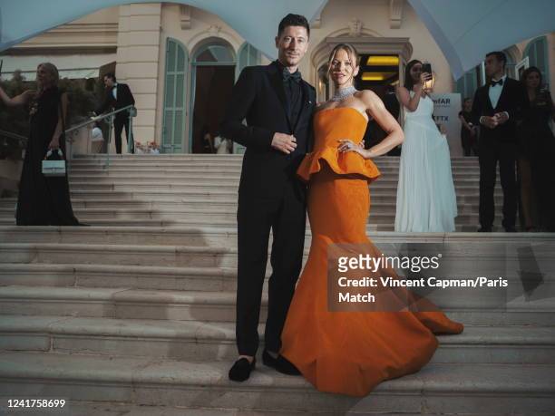 Footballer Robert Lewandowski and wife Anna are photographed for Paris Match at the AmfAR gala at the Cap-Eden-Roc Hotel on May 26, 2022 in Cap...