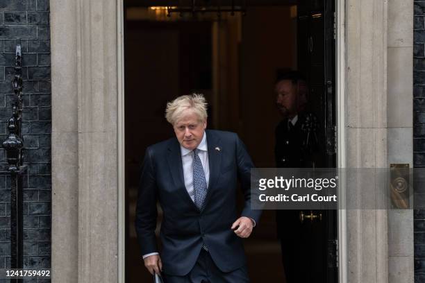 Prime Minister Boris Johnson prepares to address the nation as he announces his resignation outside 10 Downing Street on July 7, 2022 in London,...