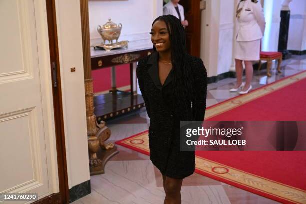 Gymnast Simone Biles arrives for a Presidential Medal of Freedom ceremony honoring 17 recipients, including Biles, in the East Room of the White...
