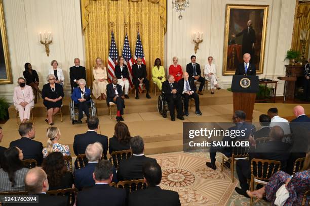 President Joe Biden speaks before presenting the Presidential Medal of Freedom, the nation's highest civilian honor, during a ceremony honoring 17...