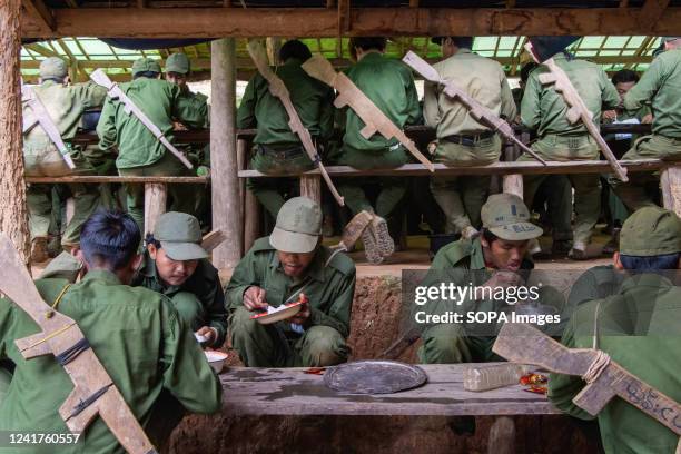 Members of the Mandalay People's Defence are seen eating food at their camp. The People's Defence force is the armed wing of Myanmar's National Unity...