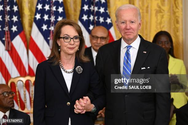 President Joe Biden presents former Congresswoman Gabby Giffords with the Presidential Medal of Freedom, the nation's highest civilian honor, during...