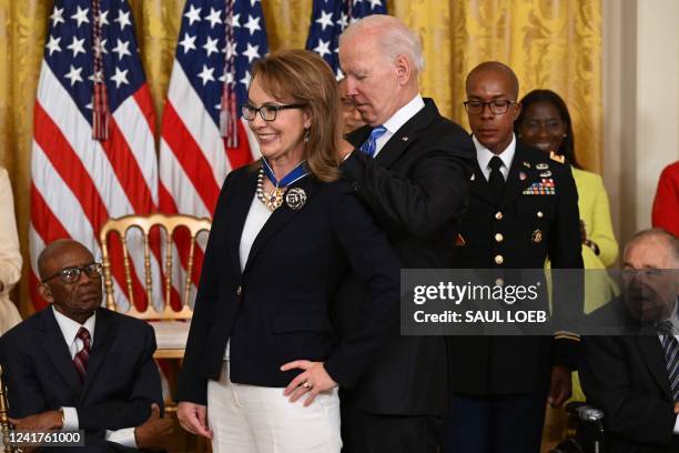President Joe Biden presents former Congresswoman Gabby Giffords with the Presidential Medal of Freedom, the nation's highest civilian honor, during...