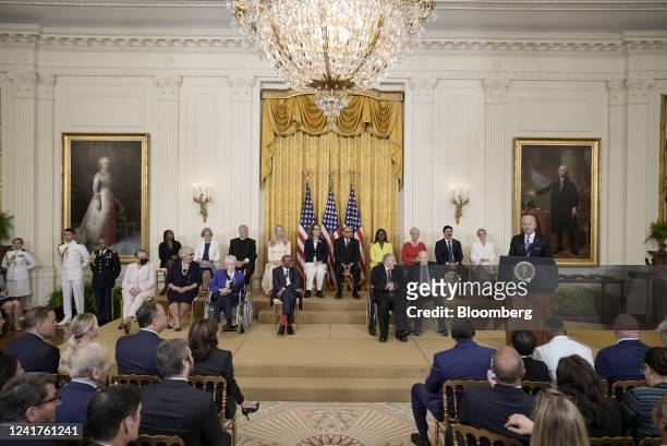 President Joe Biden speaks before presenting the Presidential Medal of Freedom during a ceremony in the East Room of the White House in Washington,...