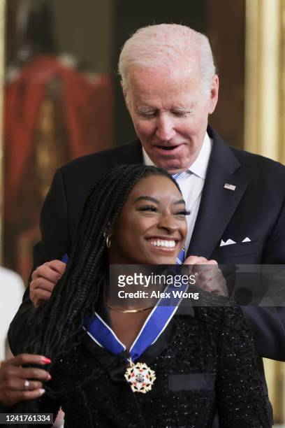 President Joe Biden presents the Presidential Medal of Freedom to Simone Biles, Olympic gold medal gymnast and mental health advocate, during a...