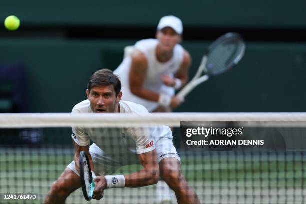 Britain's Neal Skupski and US player Desirae Krawczyk play against Australia's Matthew Ebden and Samantha Stosur during their mixed doubles final...