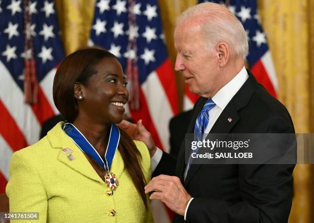 President Joe Biden presents Nurse Sandra Lindsay with the Presidential Medal of Freedom, the nation's highest civilian honor, during a ceremony...